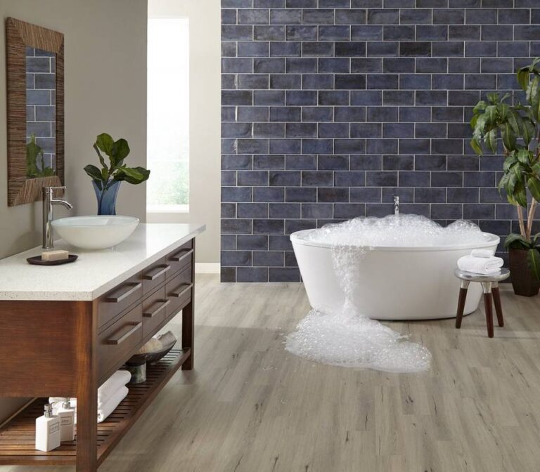 100406362_duralux-preformance-valley-mist-matte-luxury-vinyl-plank_100410984_esenzia-note-wall-tile-spill-bathroom_room